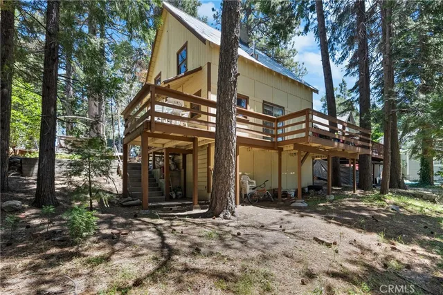 front view of a building with a tree
