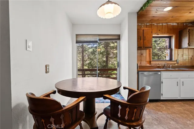 a view of a dining room with furniture and window