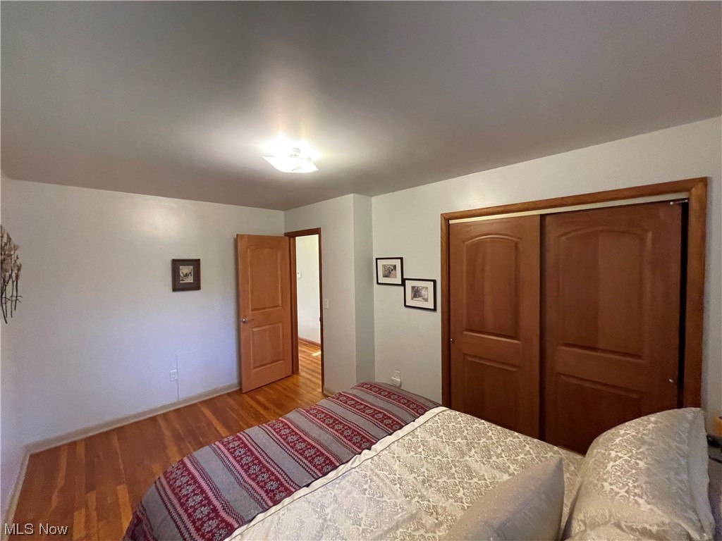 3268 Morewood Road Akron, OH 44333 - Photo 11 of 29 Owner’s suite Bedroom featuring hardwood flooring