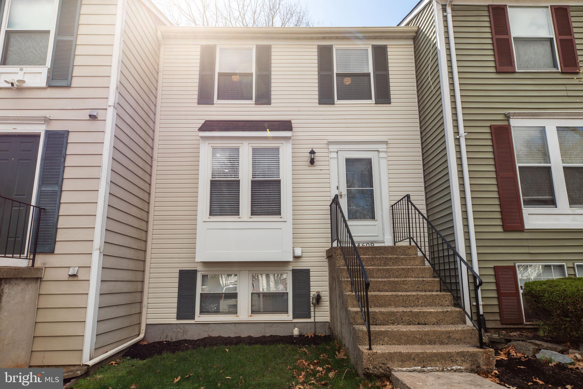 a view of a house with more windows and a fireplace