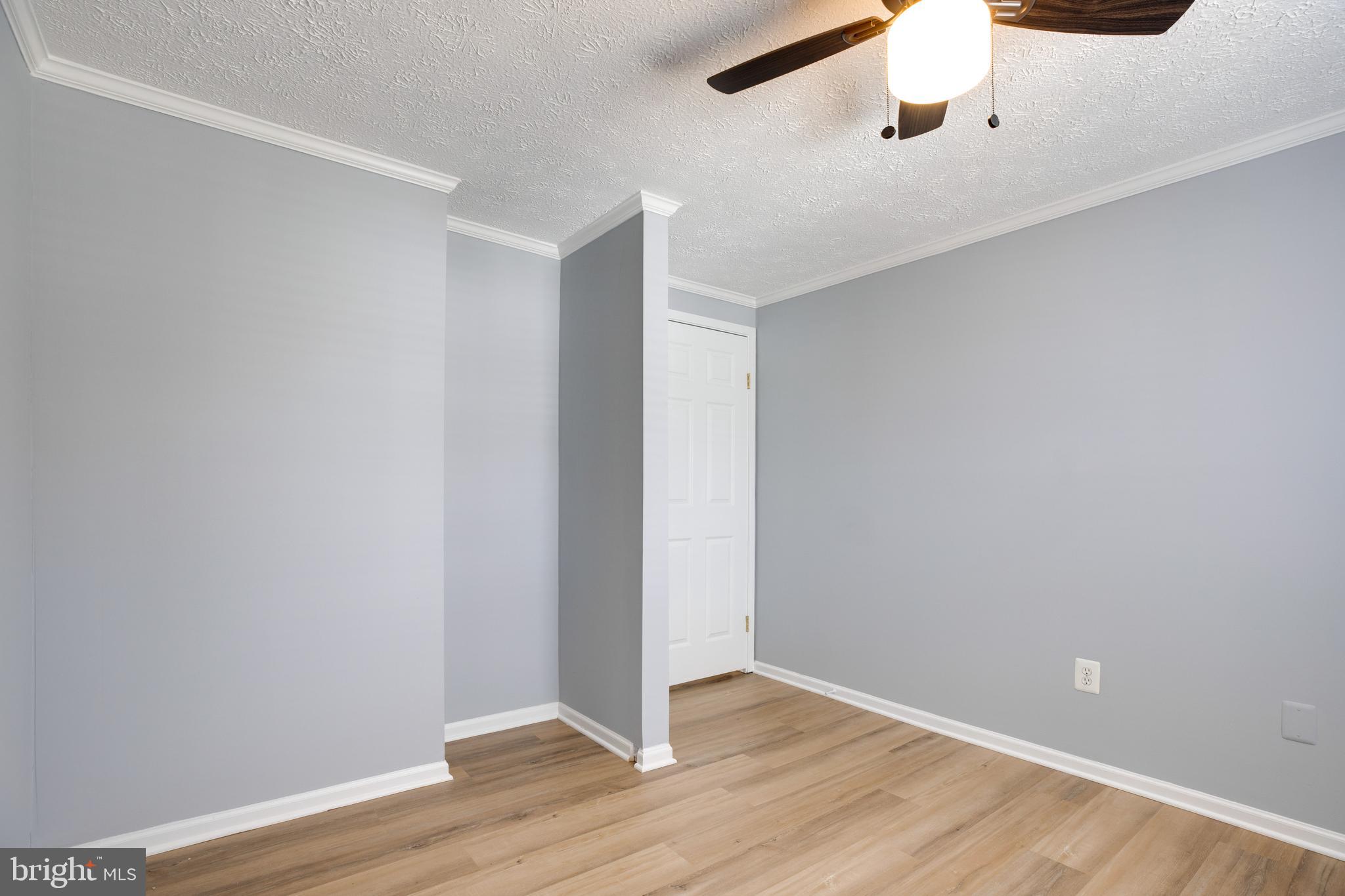 14609 Olde Kent Road Centreville, VA 20120 - Photo 22 of 33 a view of an empty room with wooden floor