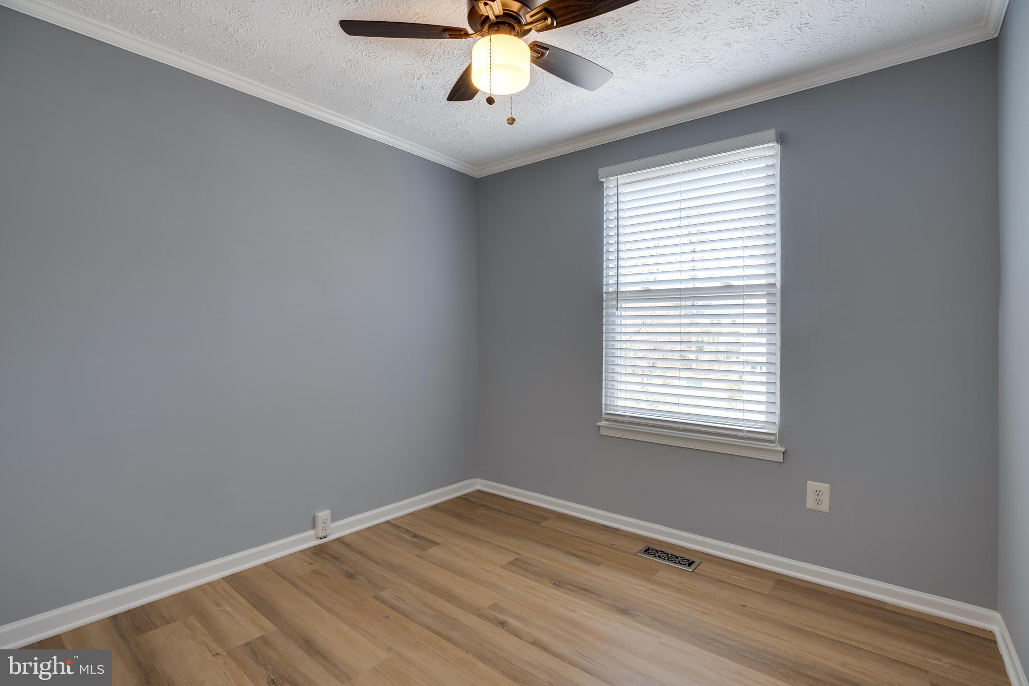 14609 Olde Kent Road Centreville, VA 20120 - Photo 25 of 33 an empty room with a window and a fan