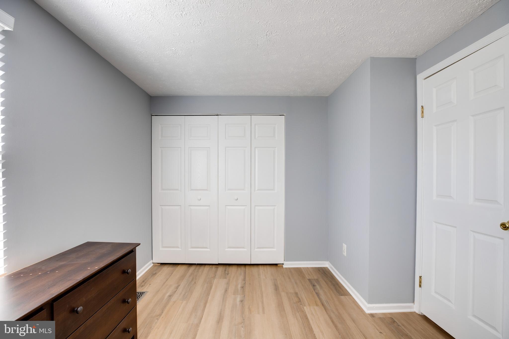 14609 Olde Kent Road Centreville, VA 20120 - Photo 28 of 33 a view of a room with wooden floor and cabinet