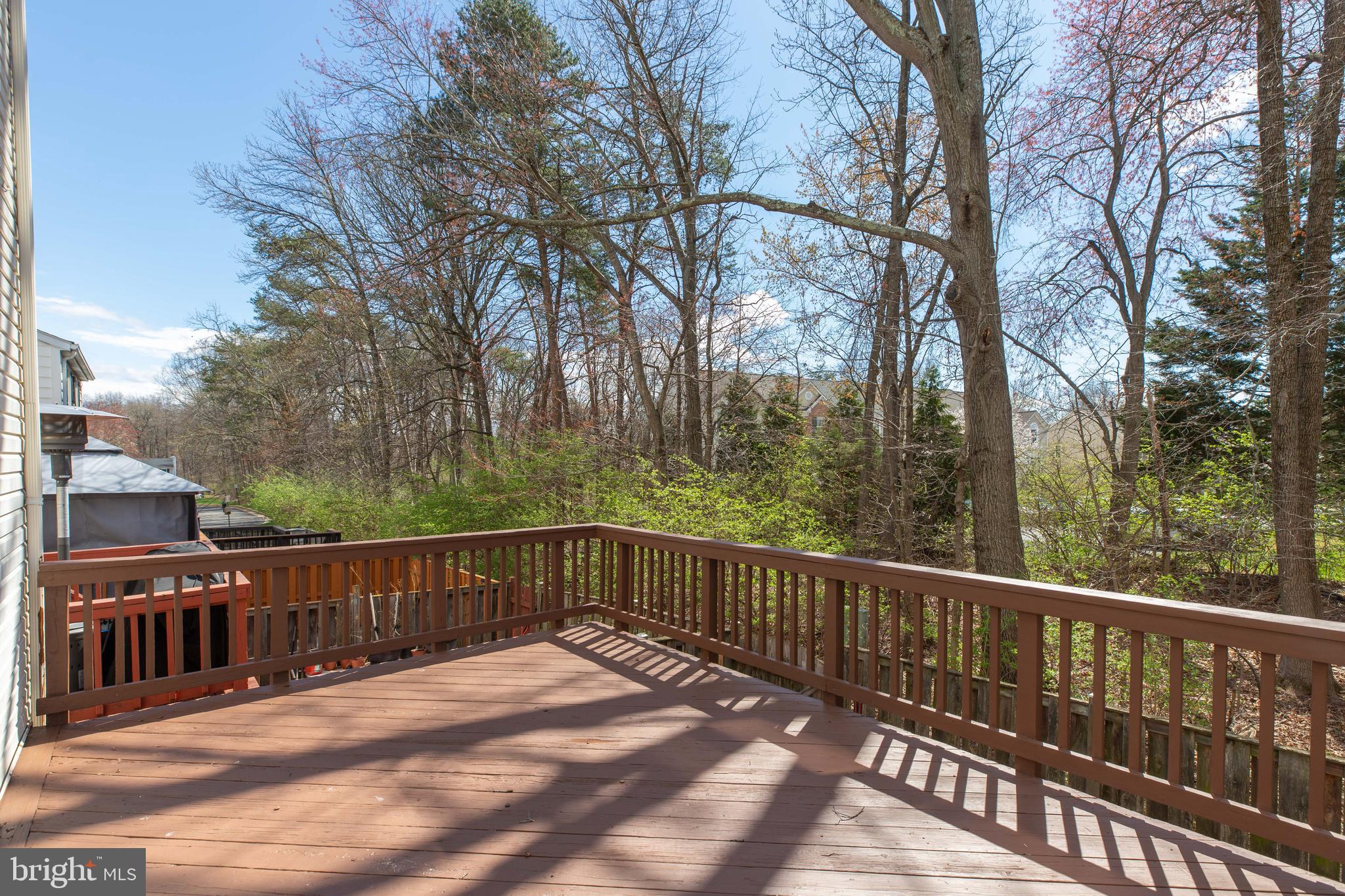 14609 Olde Kent Road Centreville, VA 20120 - Photo 29 of 33 a view of street with wooden deck and trees