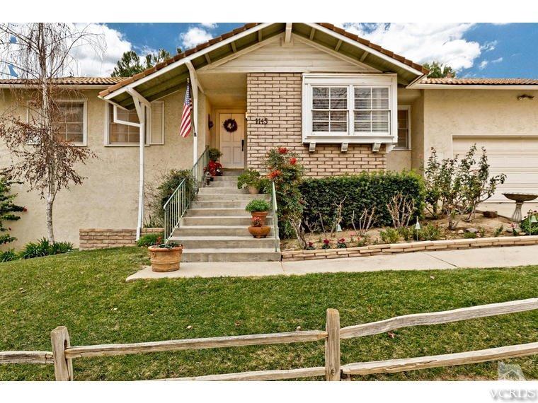 1145 Rambling Road Simi Valley, CA 93065 - Photo 2 of 30 a front view of a house with a yard