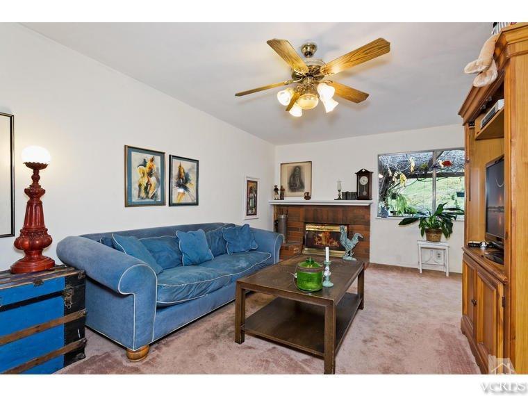 1145 Rambling Road Simi Valley, CA 93065 - Photo 13 of 30 a living room with furniture and a dining table with a bookshelf