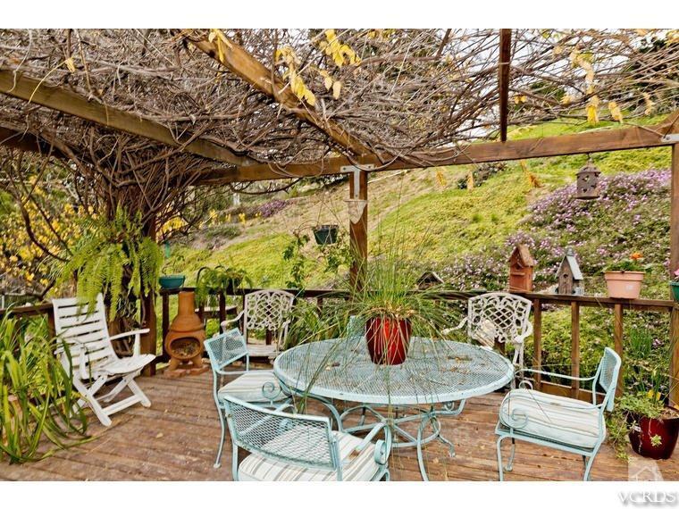 1145 Rambling Road Simi Valley, CA 93065 - Photo 20 of 30 a view of a patio with table and chairs and potted plants