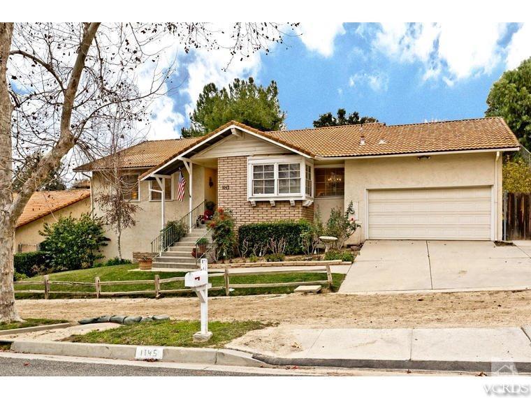 1145 Rambling Road Simi Valley, CA 93065 - Photo 3 of 30 a front view of a house with a yard