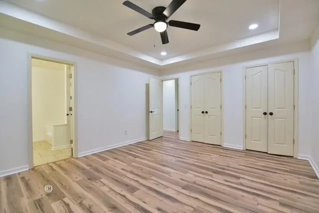 a view of a livingroom with a chandelier fan