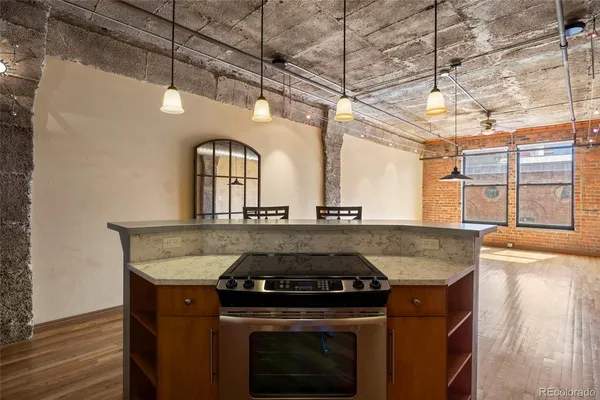 a stove top oven sitting inside of a kitchen