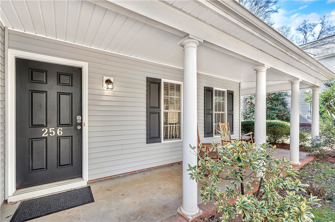 This charming residence welcomes you with a classic front porch and inviting curb appeal.