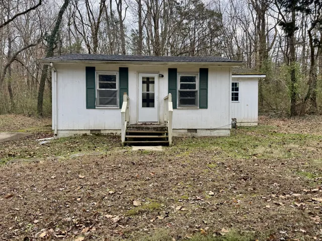 a house with trees in the background