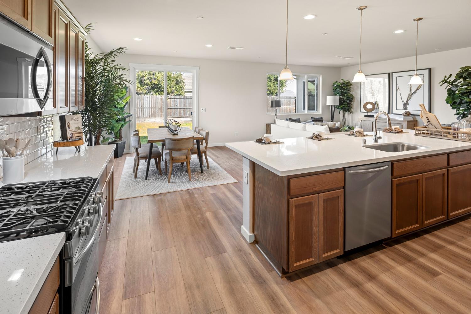 1727 Dos Rios Court Plumas Lake, CA 95961 - Photo 11 of 43 a kitchen with a sink stove and cabinets