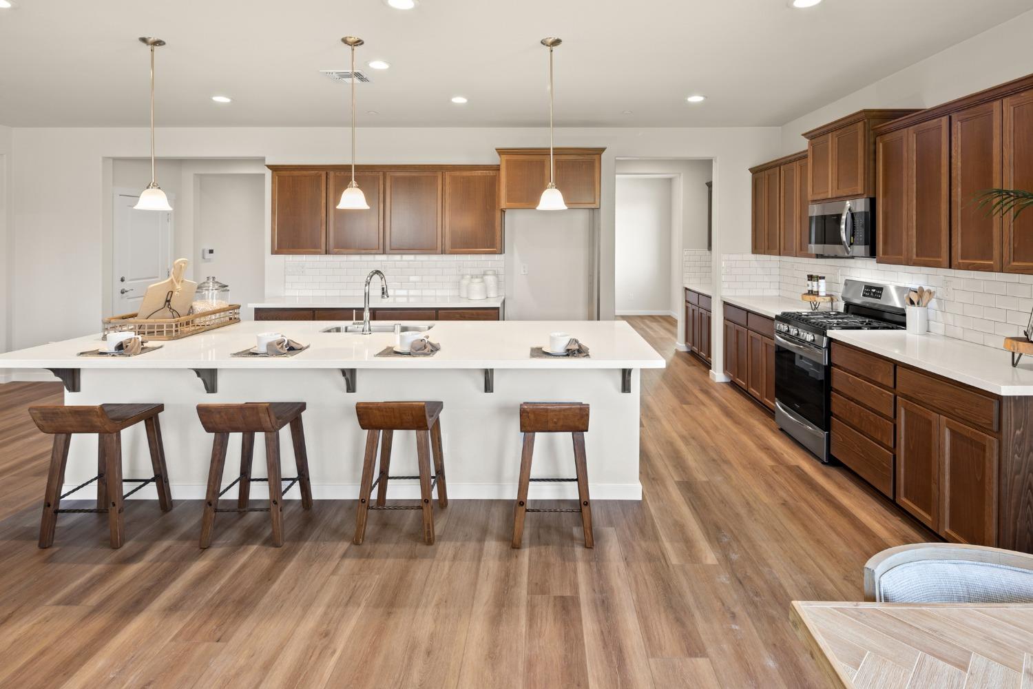 1727 Dos Rios Court Plumas Lake, CA 95961 - Photo 12 of 43 a large kitchen with a table and chairs