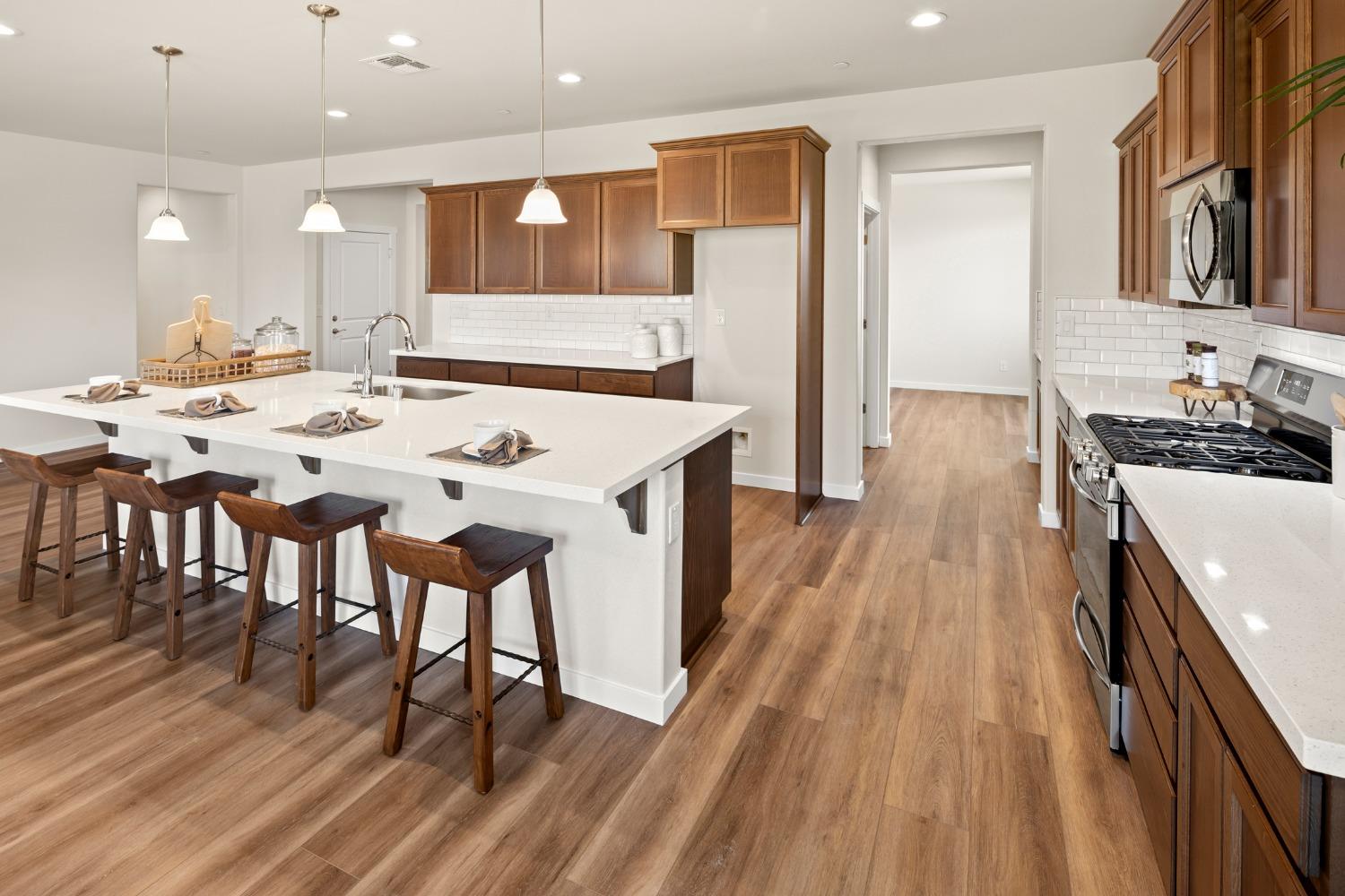 1727 Dos Rios Court Plumas Lake, CA 95961 - Photo 13 of 43 a kitchen with a sink and wooden floor