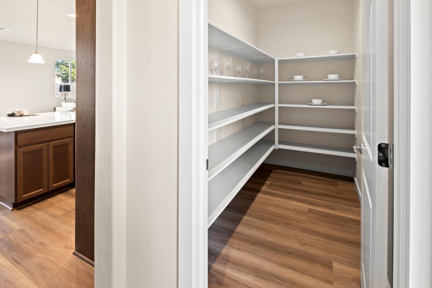 1727 Dos Rios Court Plumas Lake, CA 95961 - Photo 16 of 43 a view of walk in closet with empty racks
