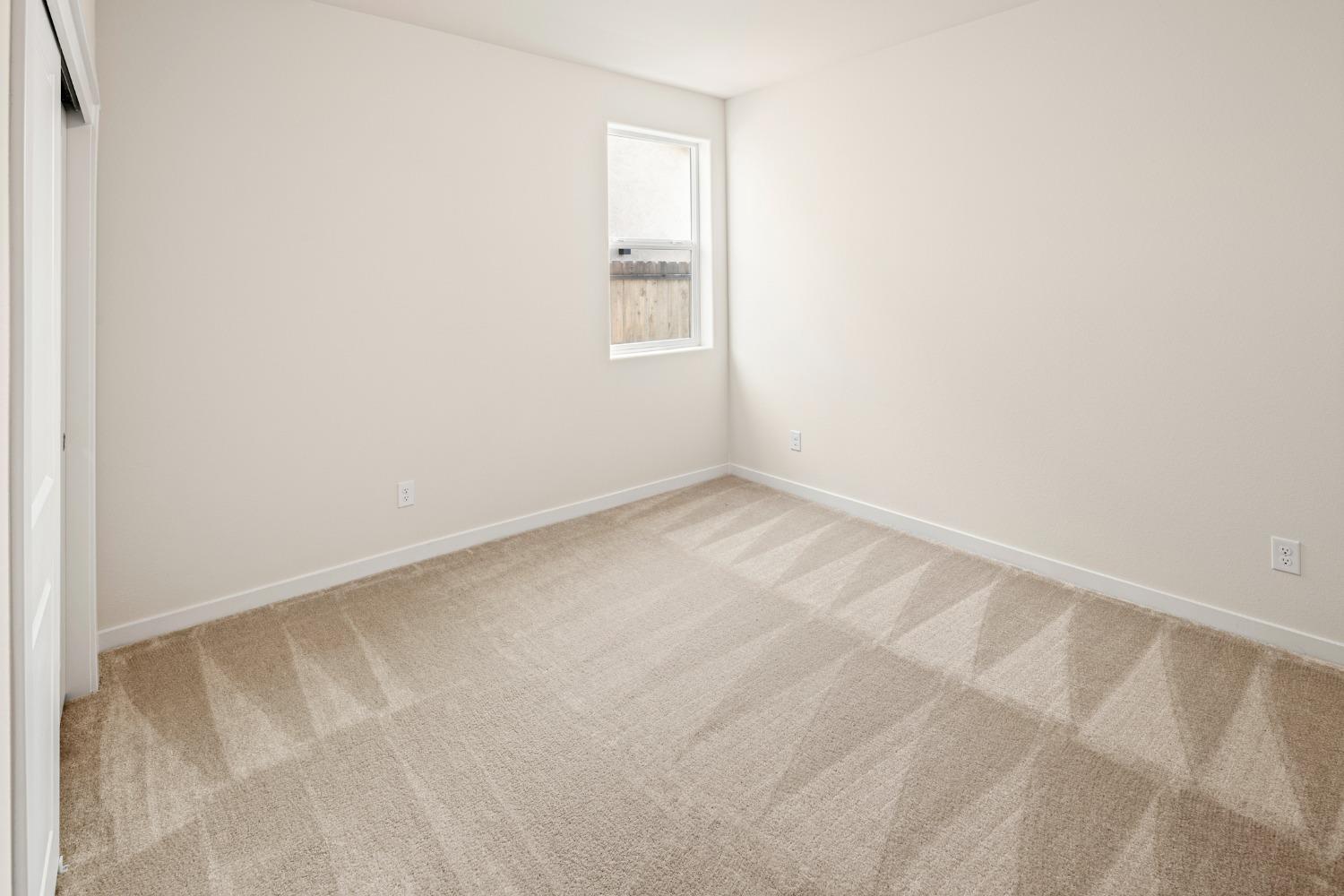 1727 Dos Rios Court Plumas Lake, CA 95961 - Photo 24 of 43 a view of an empty room with a window