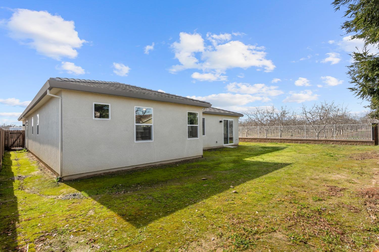1727 Dos Rios Court Plumas Lake, CA 95961 - Photo 32 of 43 a view of a backyard with swimming pool