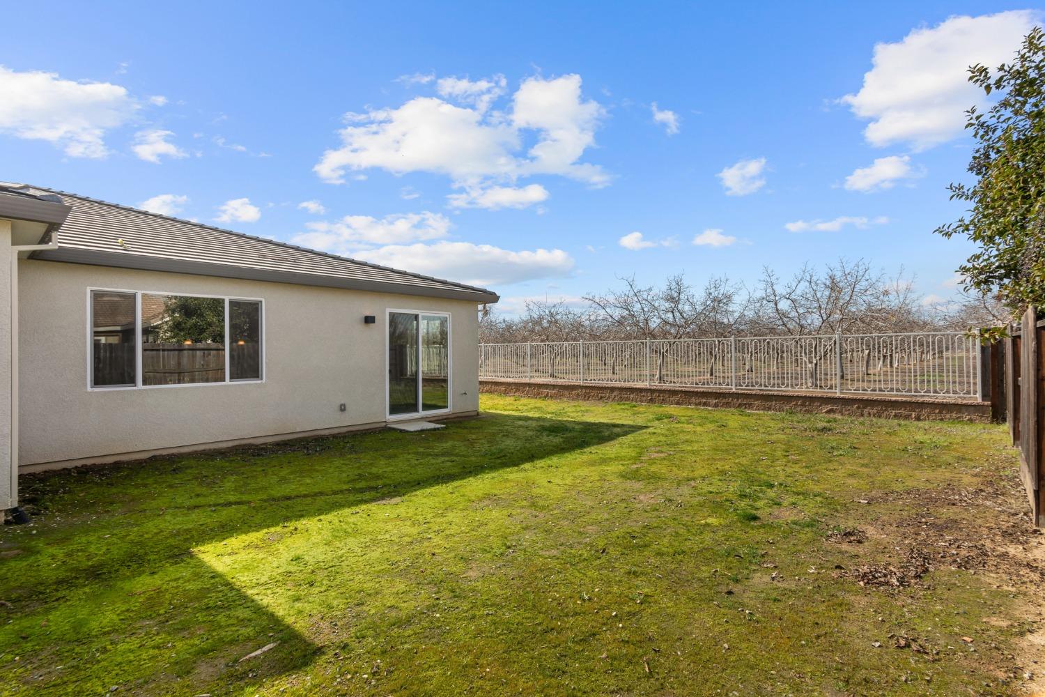 1727 Dos Rios Court Plumas Lake, CA 95961 - Photo 34 of 43 a view of an house with backyard space and balcony