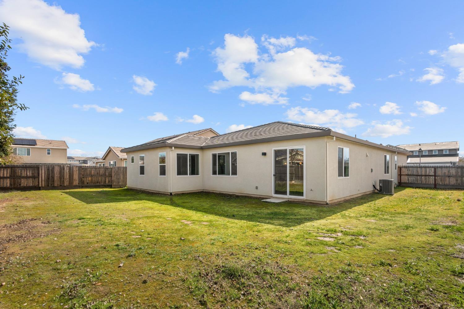 1727 Dos Rios Court Plumas Lake, CA 95961 - Photo 39 of 43 a view of a house with a big yard