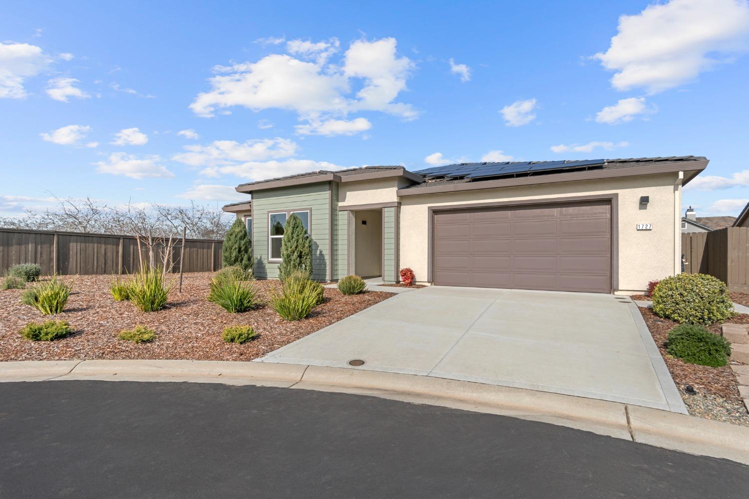 1727 Dos Rios Court Plumas Lake, CA 95961 - Photo 41 of 43 a front view of a house with a yard and garage