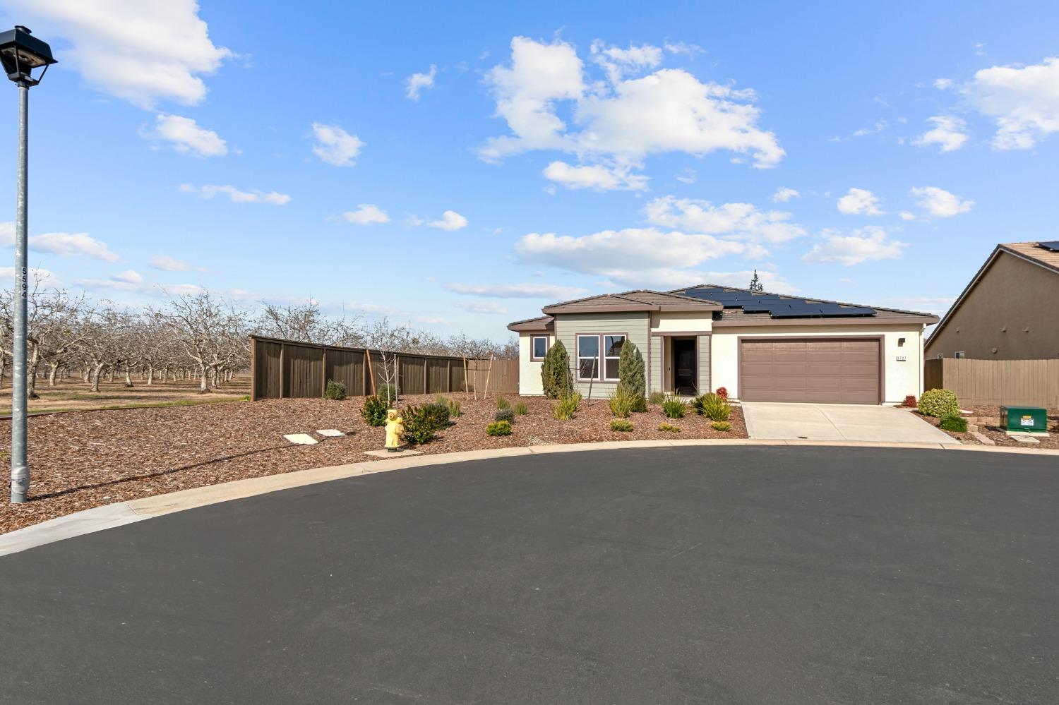 1727 Dos Rios Court Plumas Lake, CA 95961 - Photo 43 of 43 a front view of a house with a yard and garage