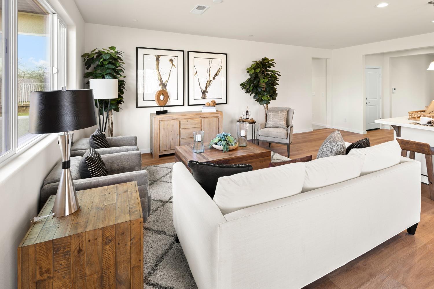 1727 Dos Rios Court Plumas Lake, CA 95961 - Photo 7 of 43 a living room with furniture and a flat screen tv