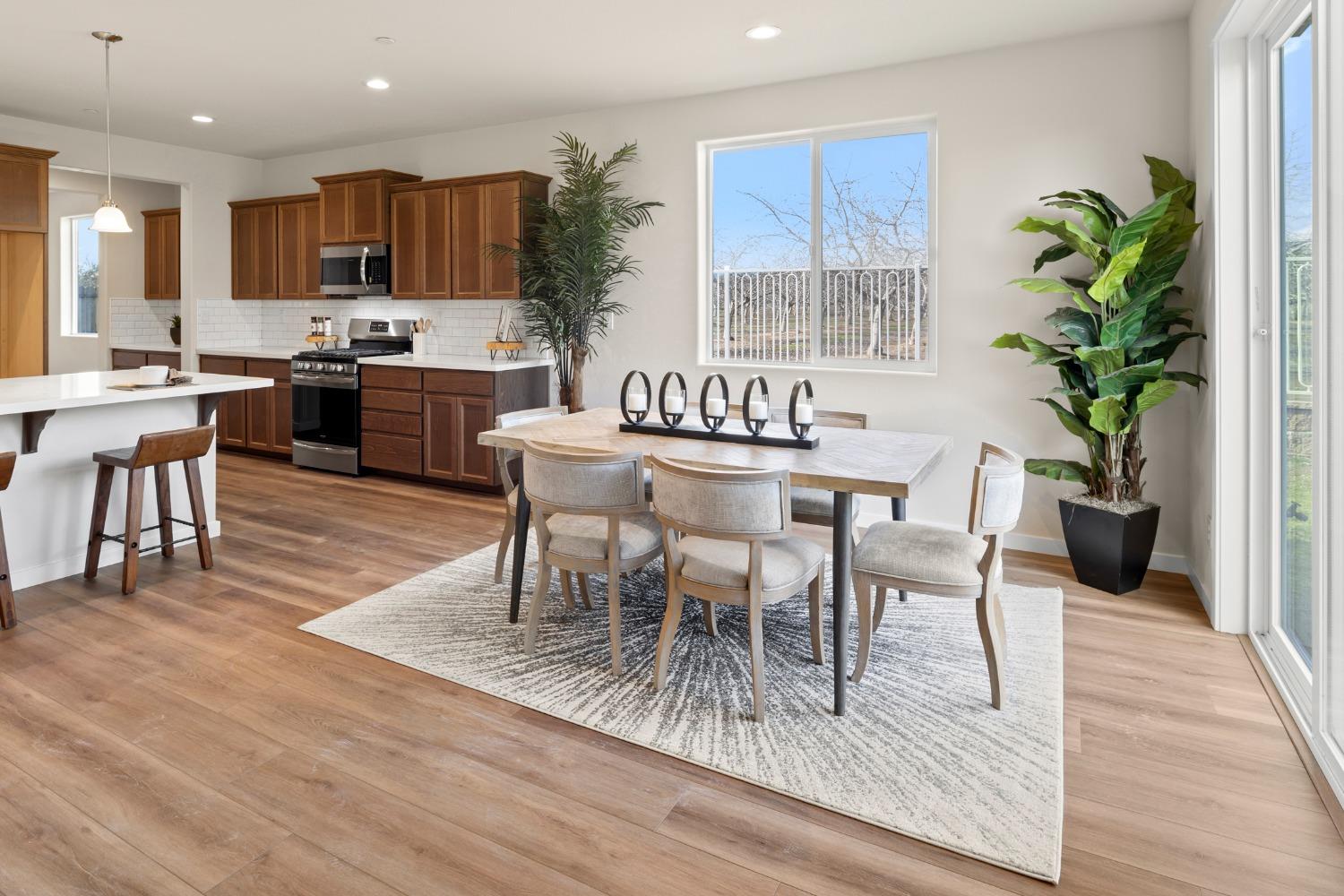 1727 Dos Rios Court Plumas Lake, CA 95961 - Photo 9 of 43 a view of a dining room with furniture and wooden floor