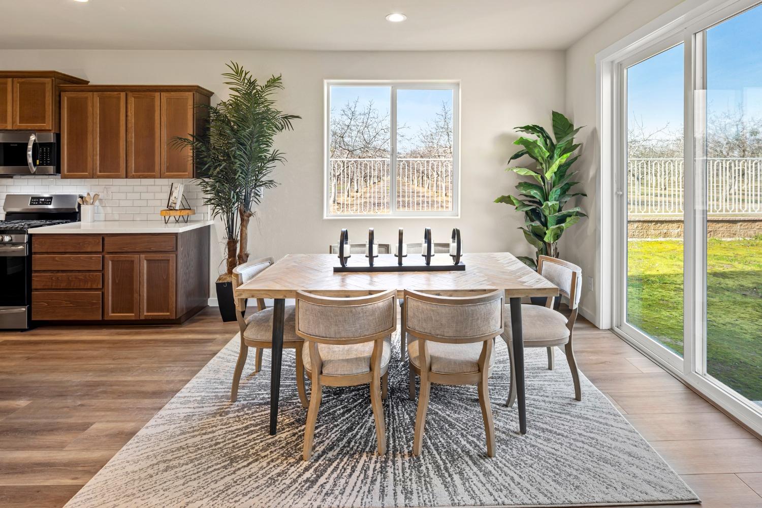 1727 Dos Rios Court Plumas Lake, CA 95961 - Photo 10 of 43 a dining room with furniture window and wooden floor