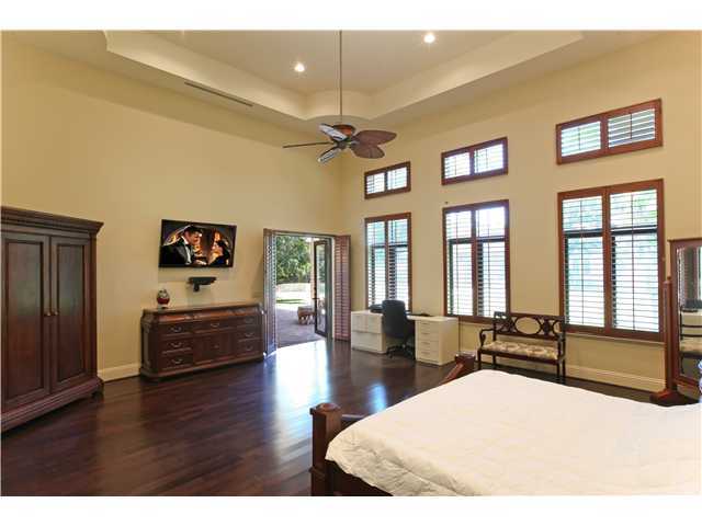 11688 Old Pump House Road Boca Raton, FL 33498 - Photo 11 of 25 a large bedroom with wooden floor and a window