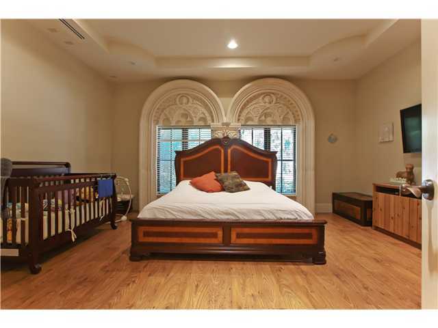 11688 Old Pump House Road Boca Raton, FL 33498 - Photo 13 of 25 a bedroom with a bed and a night stand