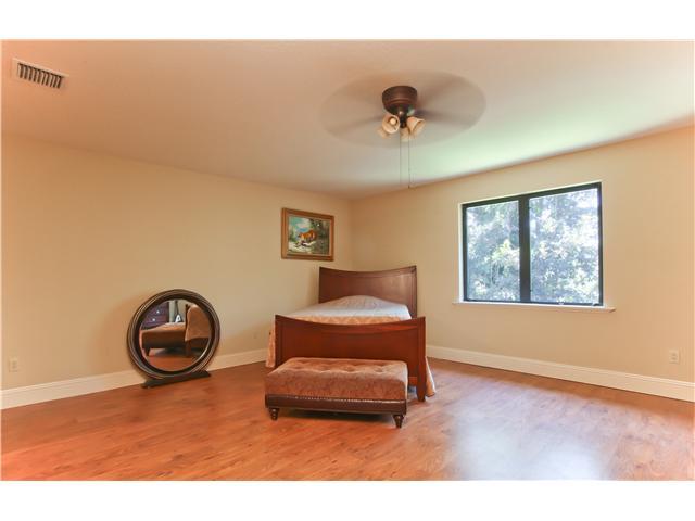 11688 Old Pump House Road Boca Raton, FL 33498 - Photo 14 of 25 a living room with a couch and a window