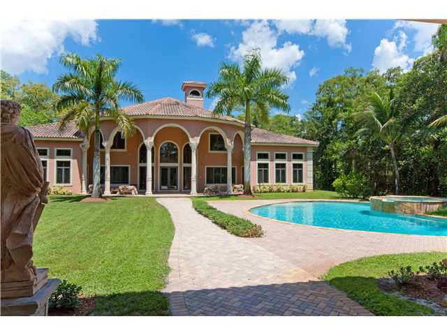 11688 Old Pump House Road Boca Raton, FL 33498 - Photo 16 of 25 a front view of a house with garden