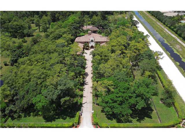 11688 Old Pump House Road Boca Raton, FL 33498 - Photo 24 of 25 a view of a garden with a building