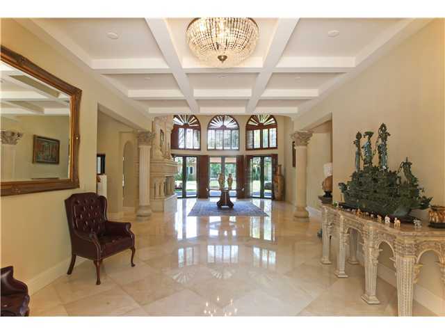 11688 Old Pump House Road Boca Raton, FL 33498 - Photo 5 of 25 a living room with furniture a chandelier and a large window