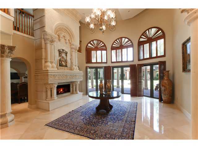 11688 Old Pump House Road Boca Raton, FL 33498 - Photo 6 of 25 a large living room with a fireplace