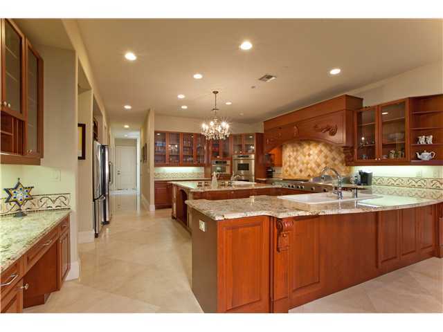 11688 Old Pump House Road Boca Raton, FL 33498 - Photo 8 of 25 a large kitchen with stainless steel appliances granite countertop a large counter top a sink and a refrigerator