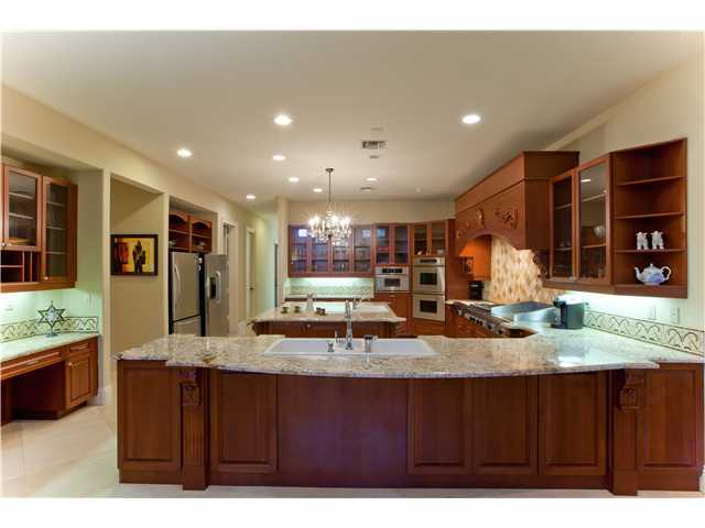 11688 Old Pump House Road Boca Raton, FL 33498 - Photo 9 of 25 a kitchen with large counter space and wooden floor