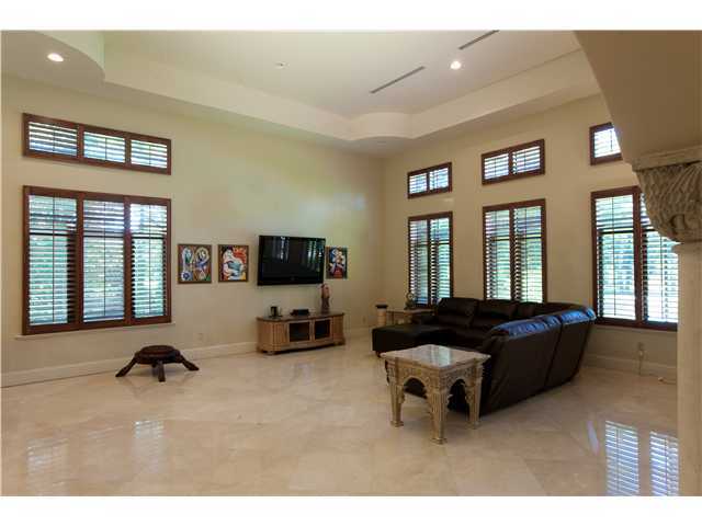 11688 Old Pump House Road Boca Raton, FL 33498 - Photo 10 of 25 a living room with furniture and a flat screen tv