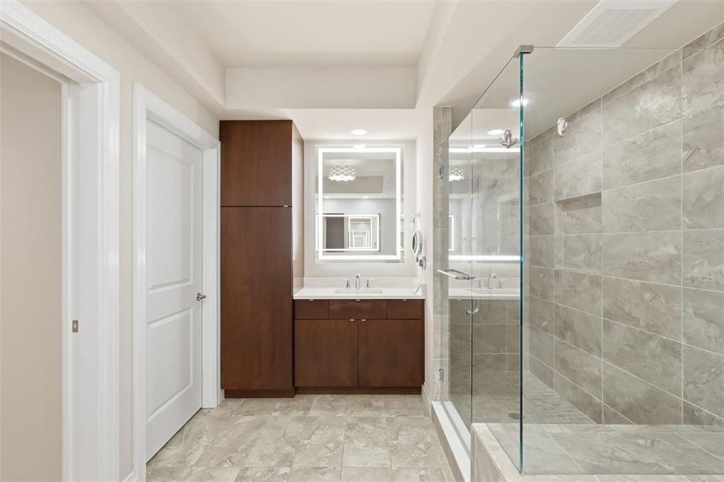 800 Collany Road, Unit 302 St. Petersburg, FL 33715 - Photo 65 of 66 a bathroom with a shower and a sink