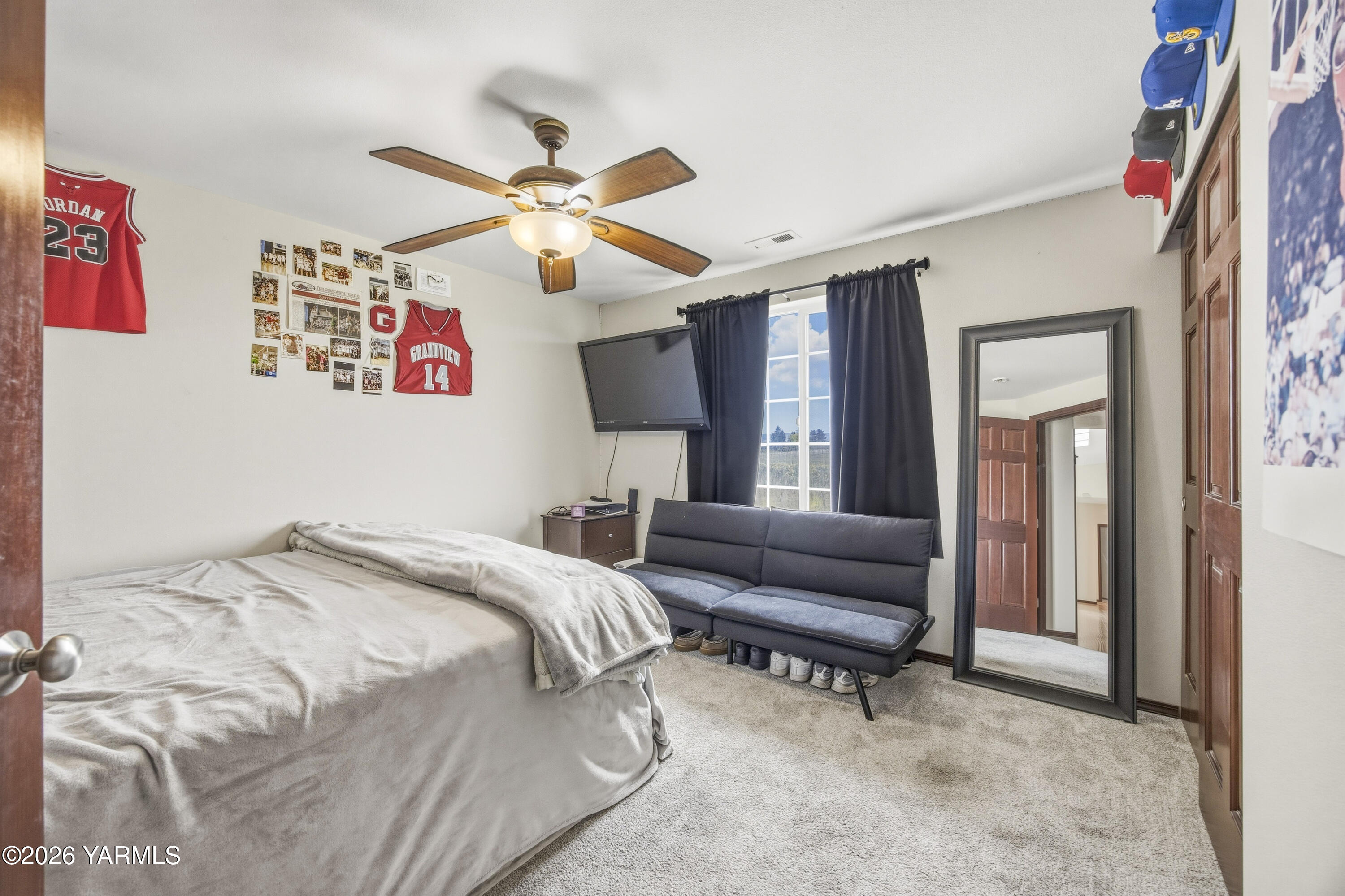 2050 Olmstead Road Grandview, WA 98930 - Photo 45 of 60 a bedroom with a bed furniture and a window