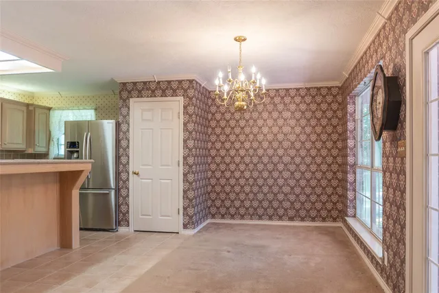 a view of a hallway with entryway door