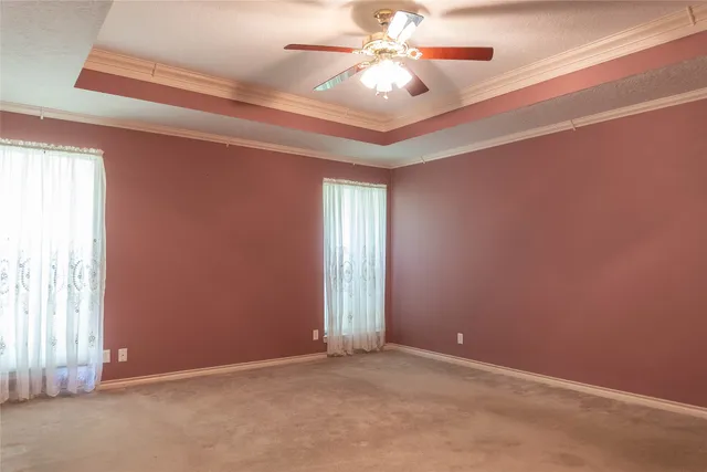 a bathroom with a bathtub a shower a sink and a window