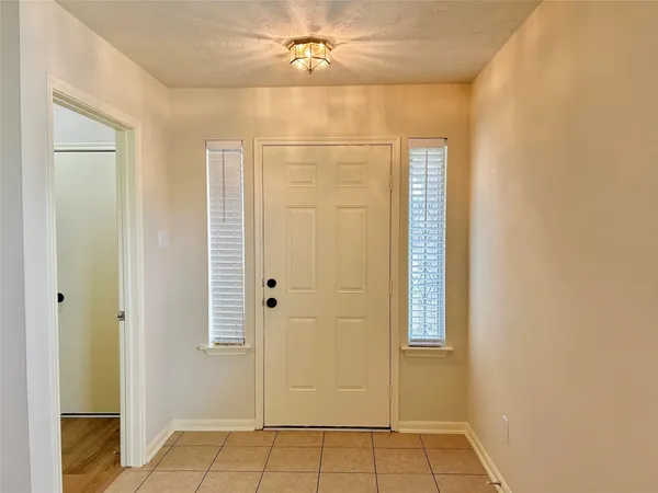 a bathroom with a shower and a mirror