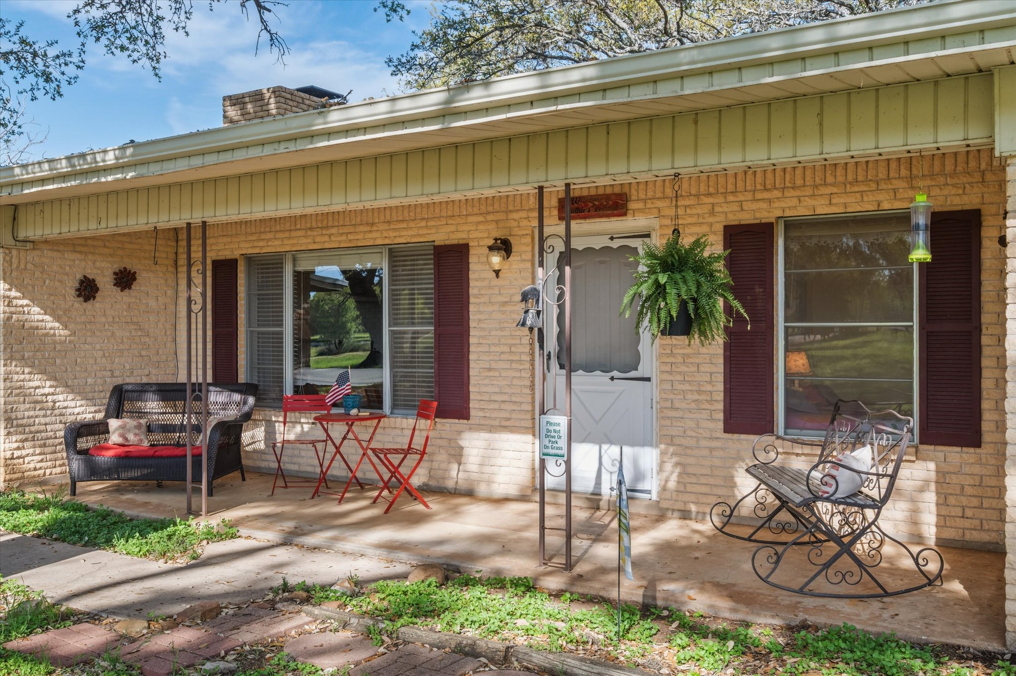 210 Lake Loop Tow, TX 78672 - Photo 4 of 28 Property entrance with 100 % Maon siding, mid-century brick. Enjoy the evening Sunsets off your covered front porch.