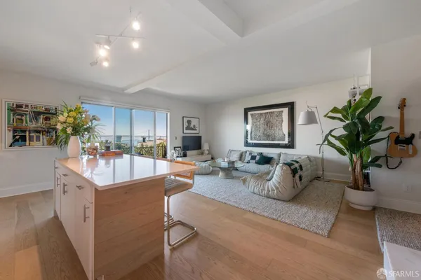 a view of a living room and dining room