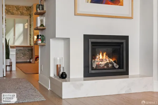 a view of living room with furniture and fireplace