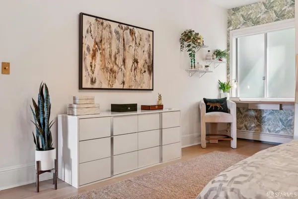 a room with a bed and furniture