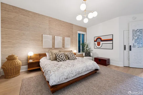 a bedroom with a bed and ceiling fan