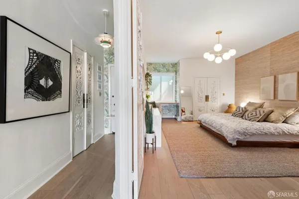 a living room with furniture and a chandelier